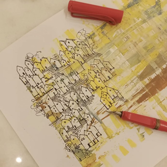 Gisela dibujando la primera obra de la serie Casitas con pluma